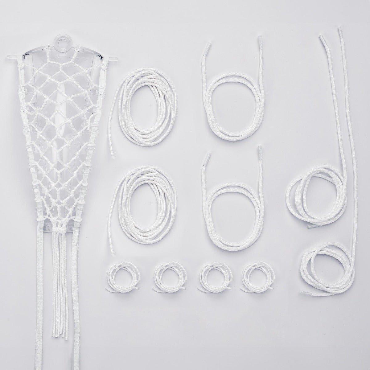 women's lock pocket stringing kit all strings laid out white